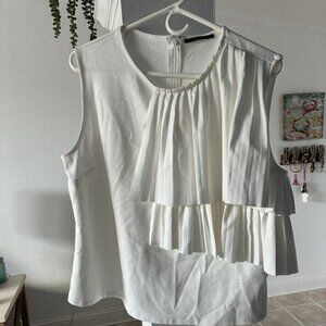 Tahari size Xl top with unique style.   Stretch material -white cream color.